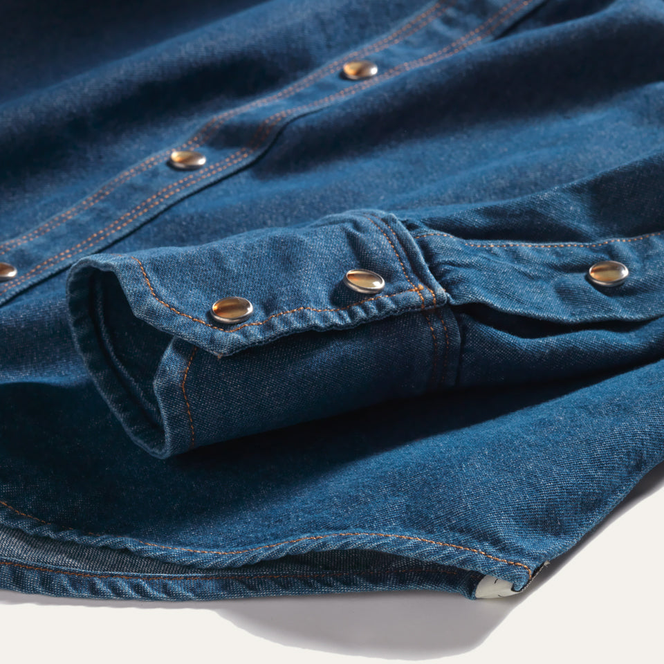 Sleeve close up of Blue Washed chambray western snap shirt with Native American Ginew Tag 