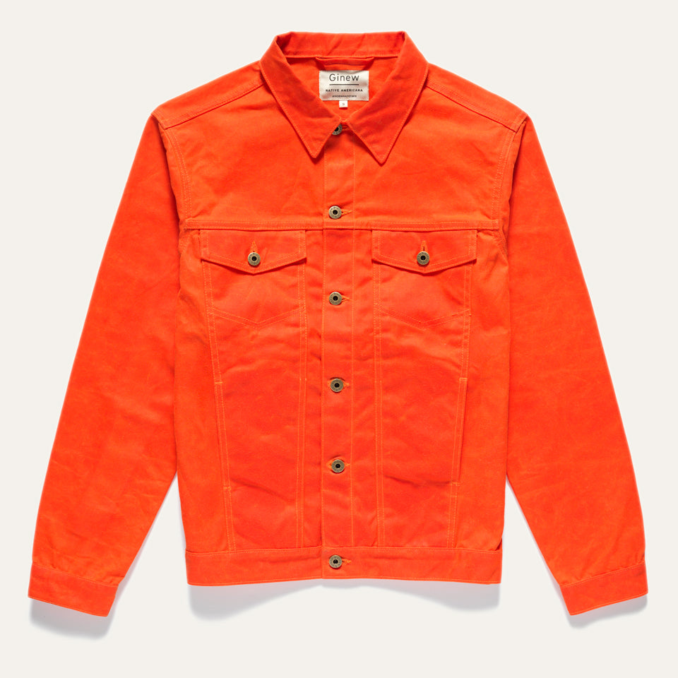 Full front view of Wax Canvas Rider Jacket in Orange. Features two front chest and side pockets and custom Ginew hardware (buttons). Jacket on a neutral background.
