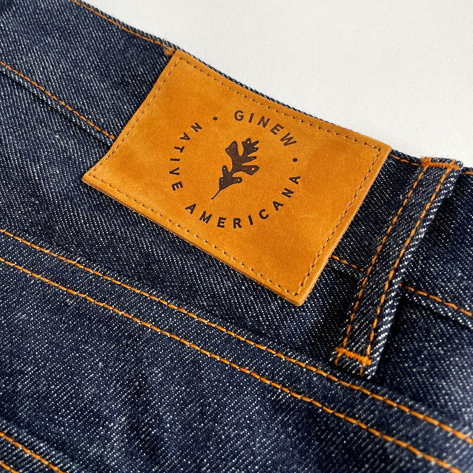 Selvedge denim jean made in USA all cotton close up with leather patch 