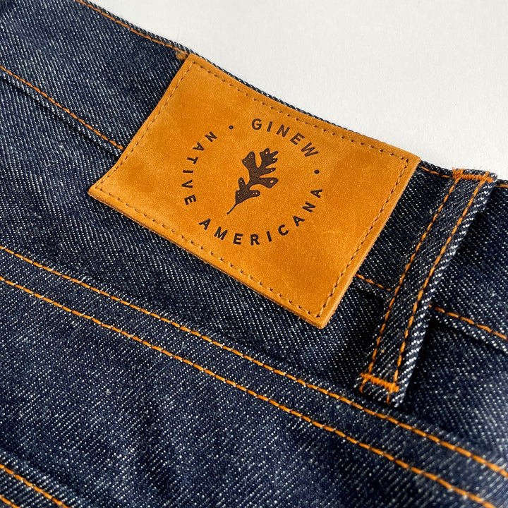Selvedge denim jean close up with leather patch 