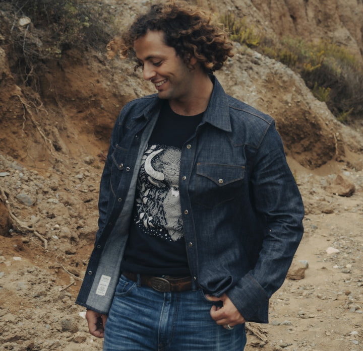 Western chambray snap shirt on man with buffalo tshirt in canyon