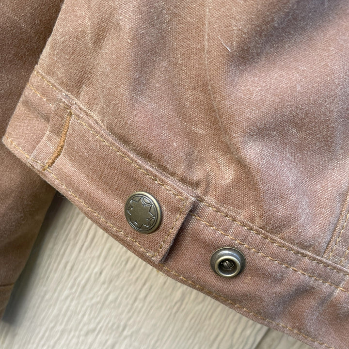 Adjustable buttons at waist on Women's brown wax canvas coat with colorful, southwest Pendleton wool lining with Native American Ginew tag