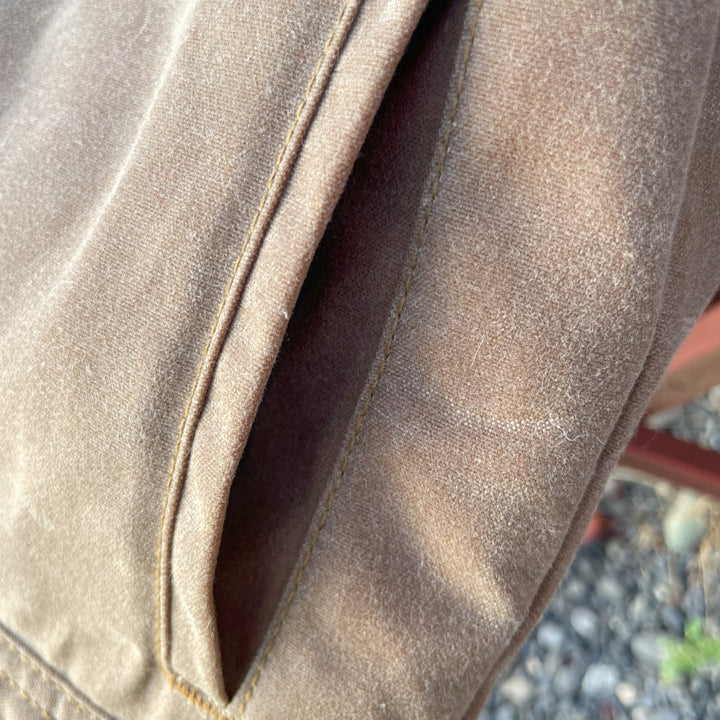 Side pocket of Women's brown wax canvas coat with colorful, southwest Pendleton wool lining 