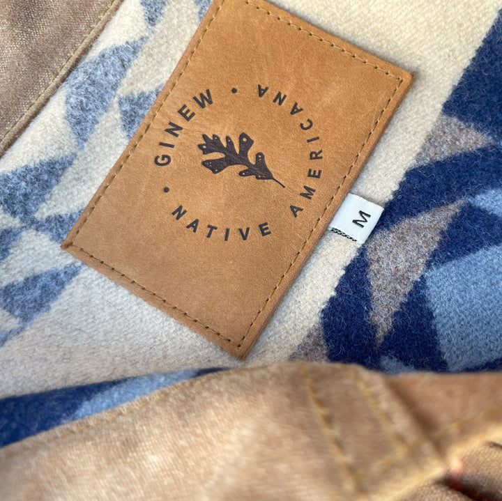 Native American Ginew leather tag on Women's brown wax canvas coat with colorful, southwest Pendleton wool lining with Native American Ginew tag