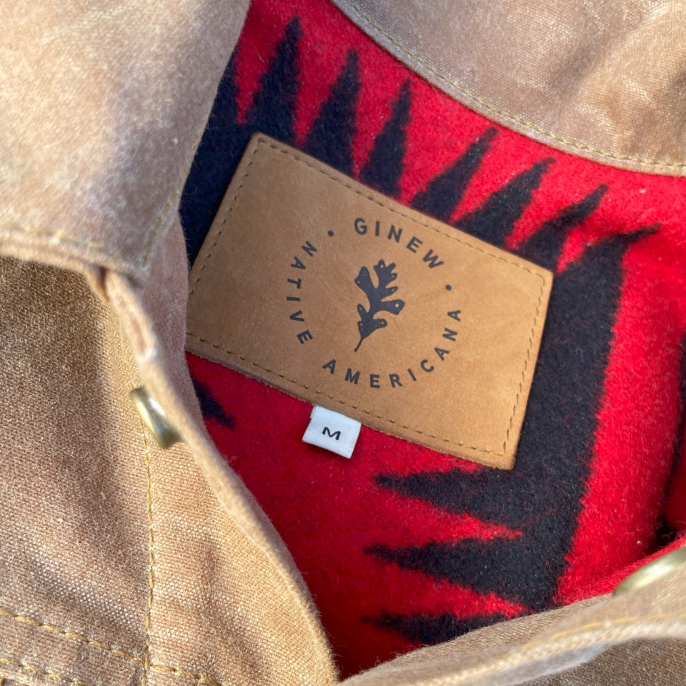 Leather tag on Womens brown wax canvas type 2 coat with red and black Pendleton lining with Native American Ginew tag