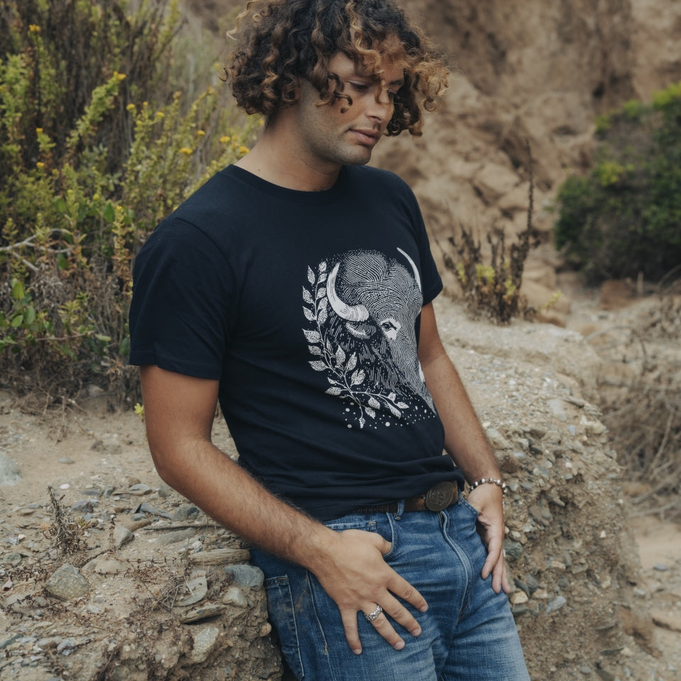 Buffalo head tshirt on man in canyon