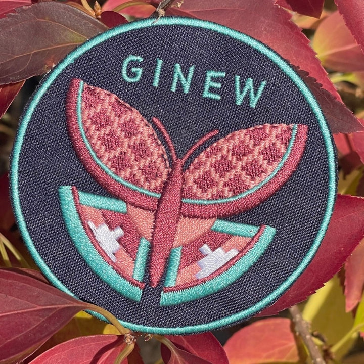 Embroidered butterfly patch in leaves