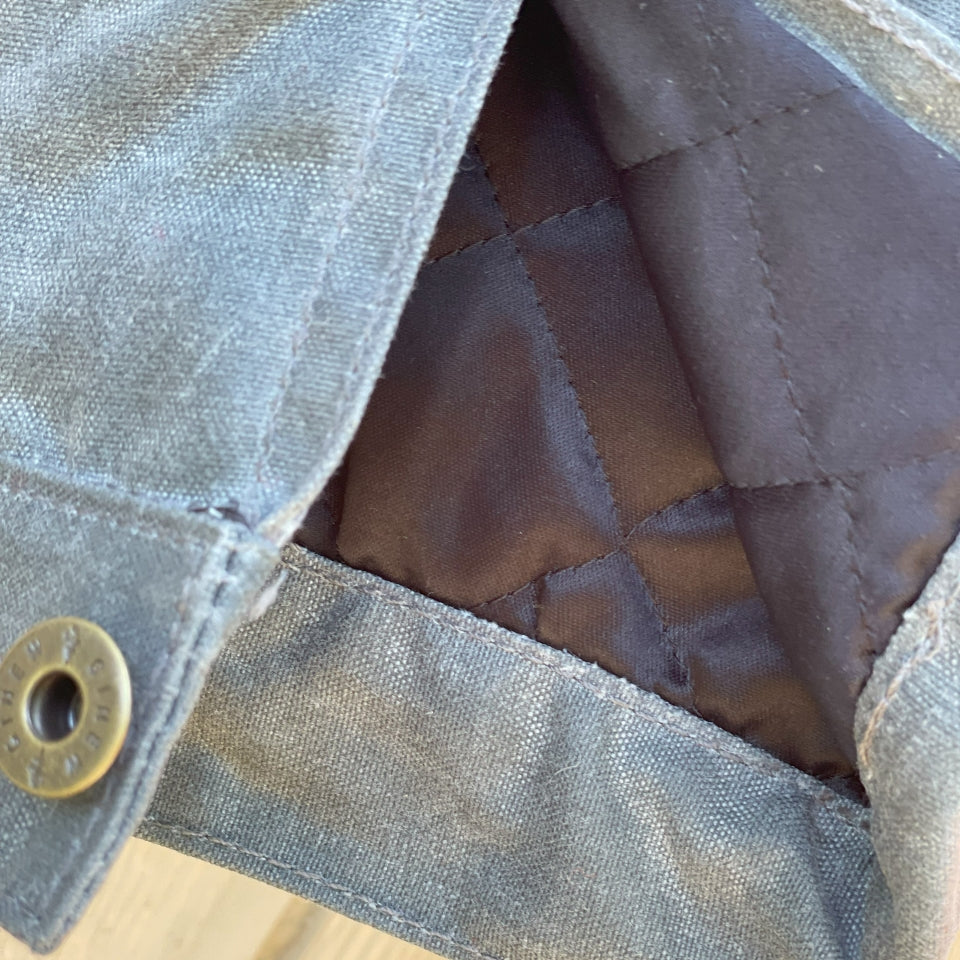 Arm quilting on grey sober charcoal rider coat by Ginew 