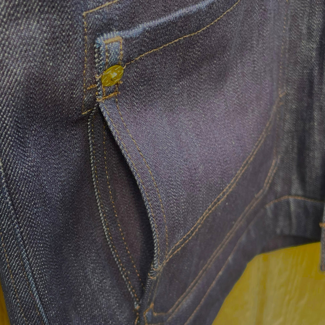 Pocket close up on Indigo Denim Chore Barn Field oat with wool lining and Native American Thunderbird 