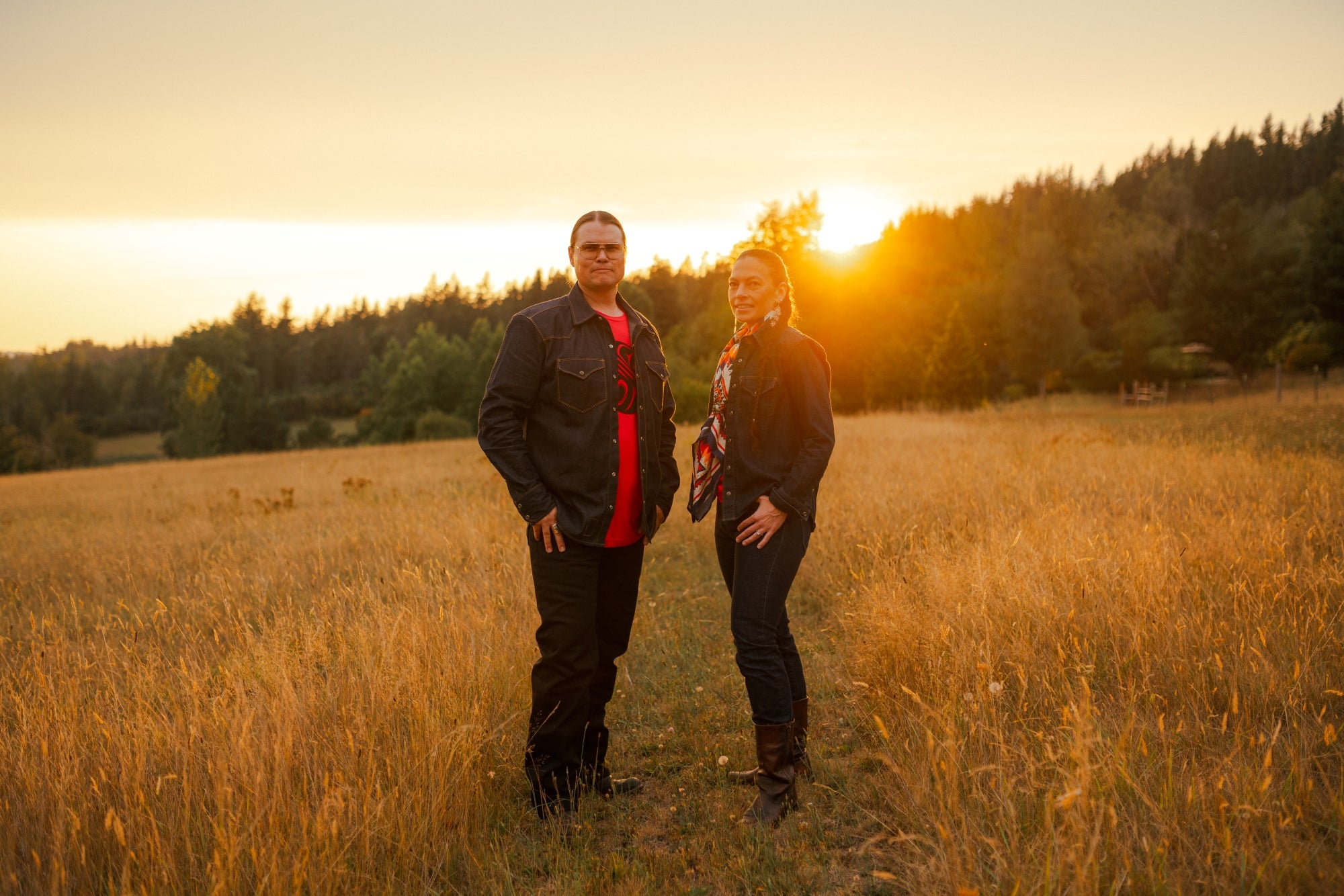 Indigenous man and women in cotton tops and denim jeans by Ginew 