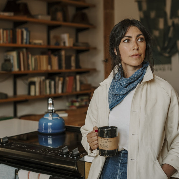 woman wearing ight blue, 100% COTTON bandana made in USA by; Native American company Ginew