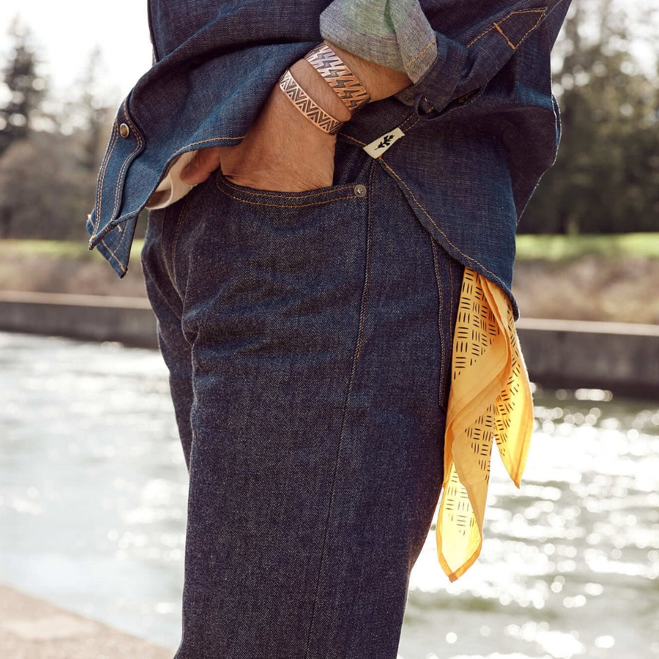 Made in USA all cotton yellow bandana in back pocket of Native American wearing selvedge denim