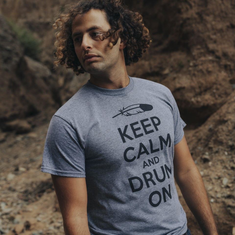 Man wearing Keep Calm and Drum On tshirt in canyon