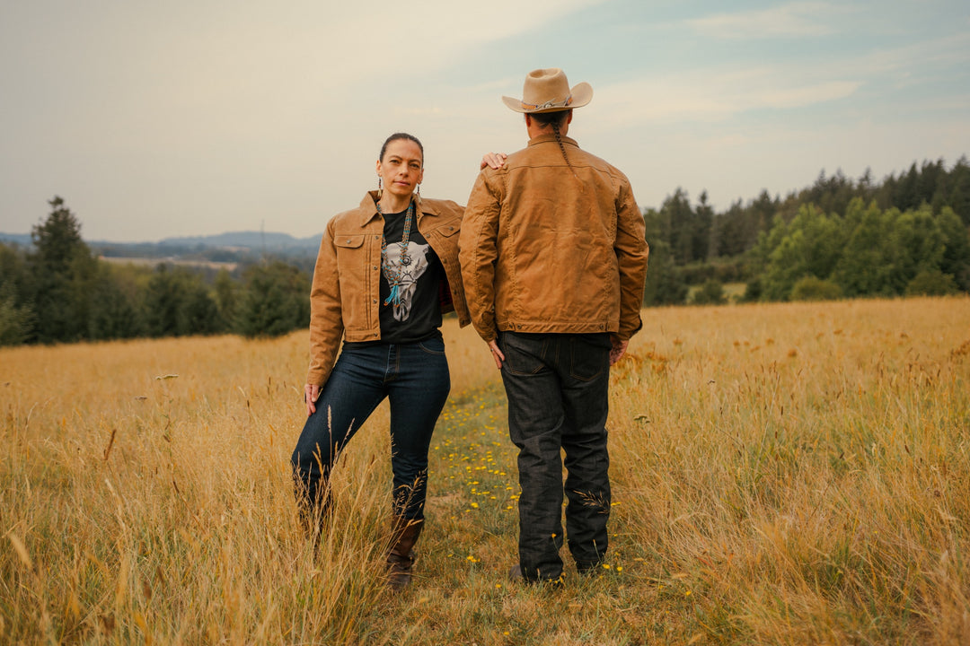Native Americans in lined wax canvas coats in field