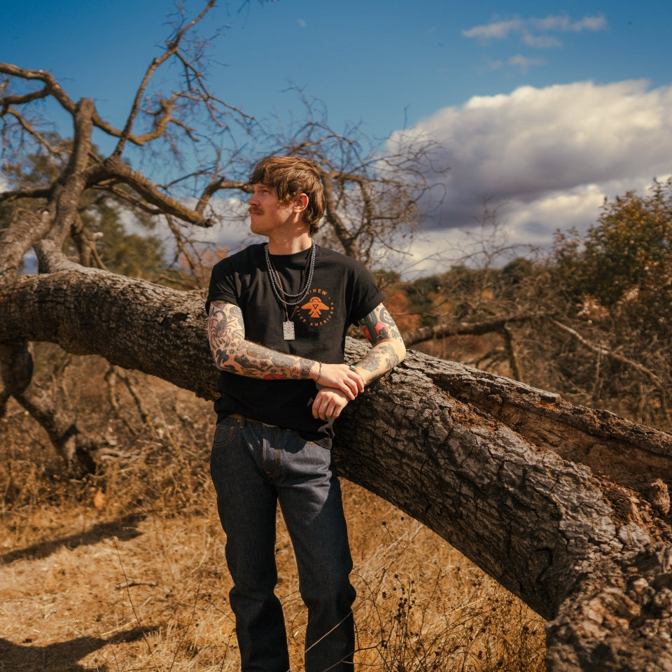 Black cotton Native American Thunderbird t-shirt on man in nature