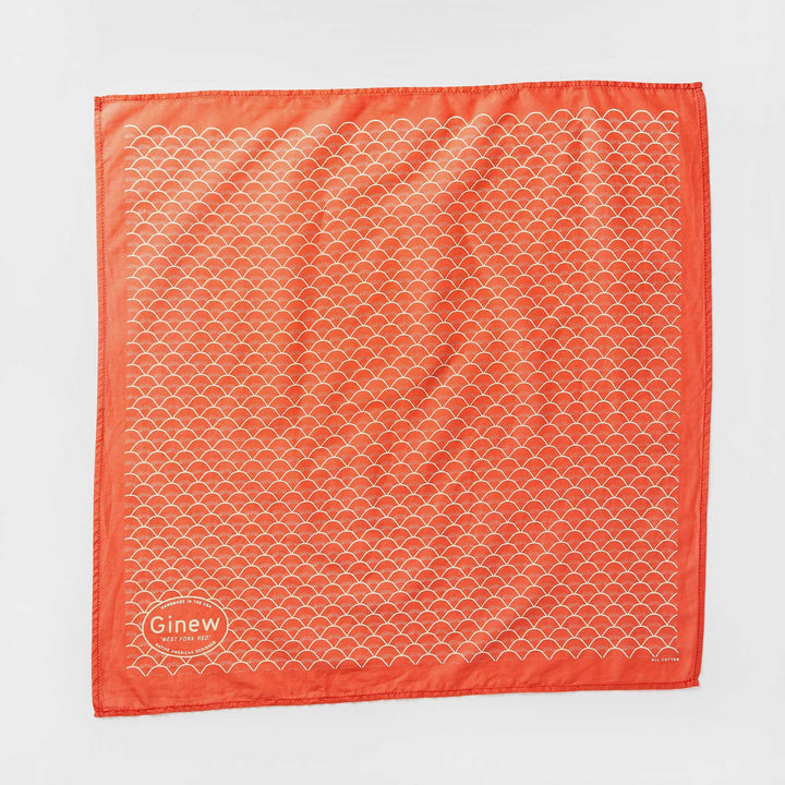 Red bandana printed with West Fork design laying flat on a neutral background.