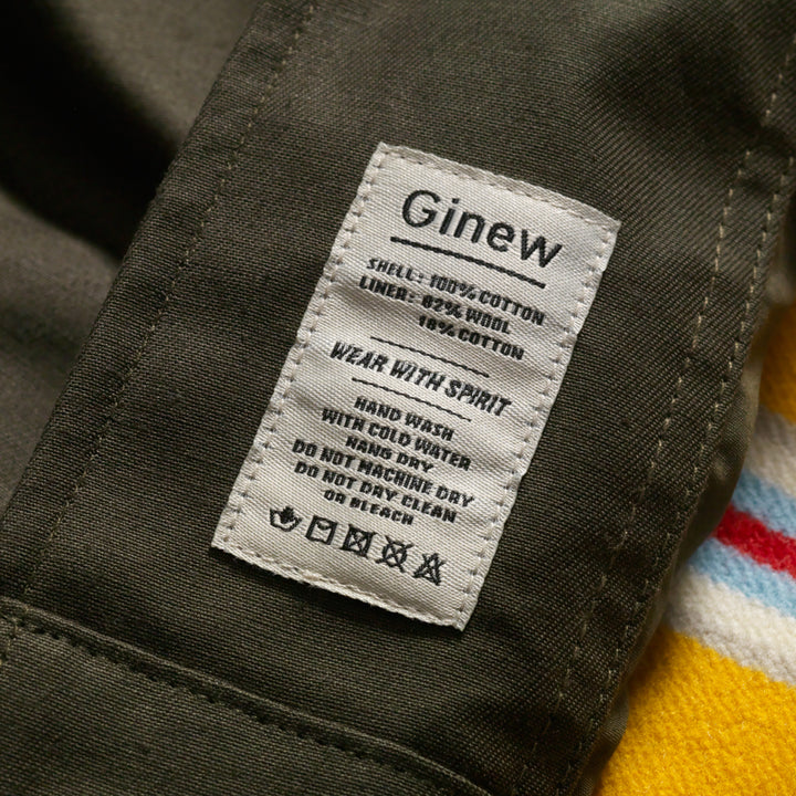 Tag on Military style coat made in USA by Native American owned Ginew