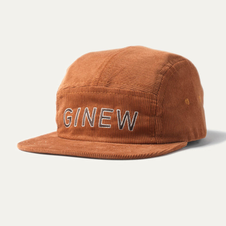 Corduroy Camper Hat in a rust-orange color. Embroidered text reads: "GINEW" on front.