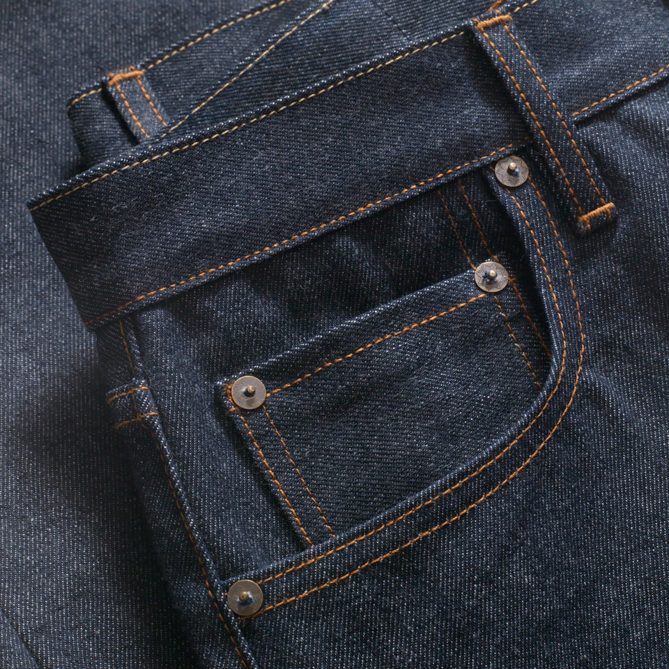 Detail of front pocket: Custom Ginew® Brass & Copper Hardware and gold stitching