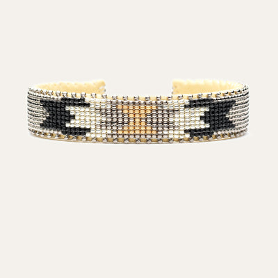 Black, silver and gold design; Hand-beaded bracelet; white background