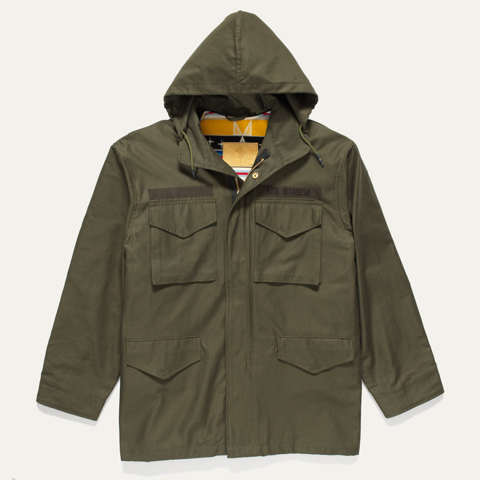 Green Military Coat with detachable hood show up and removable vest showing yellow and black pattern. 