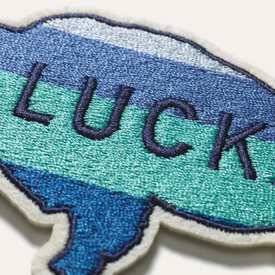 Close up of the word "LUCK" embroidered on the buffalo patch
