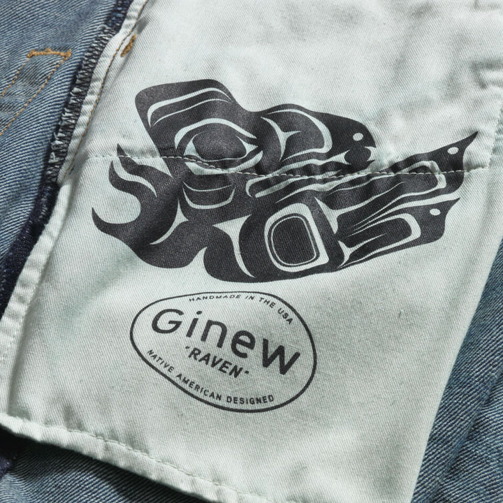 Close up of inside pocket bag which features a raven designed by Jennifer Younger and printed words that read: "GINEW 'Raven' Handmade in the USA. Native American Designed"