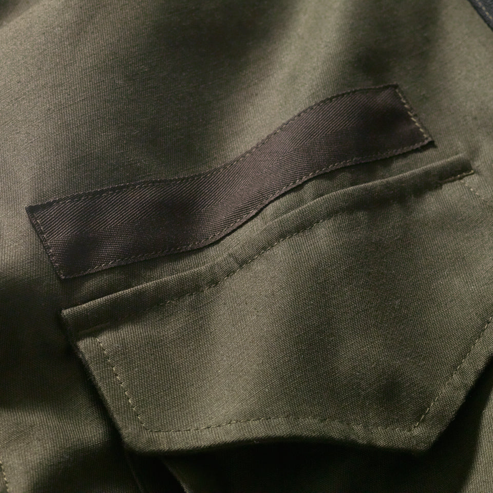 BLANK STENCIL area of green military coat with reversable and removable wool vest