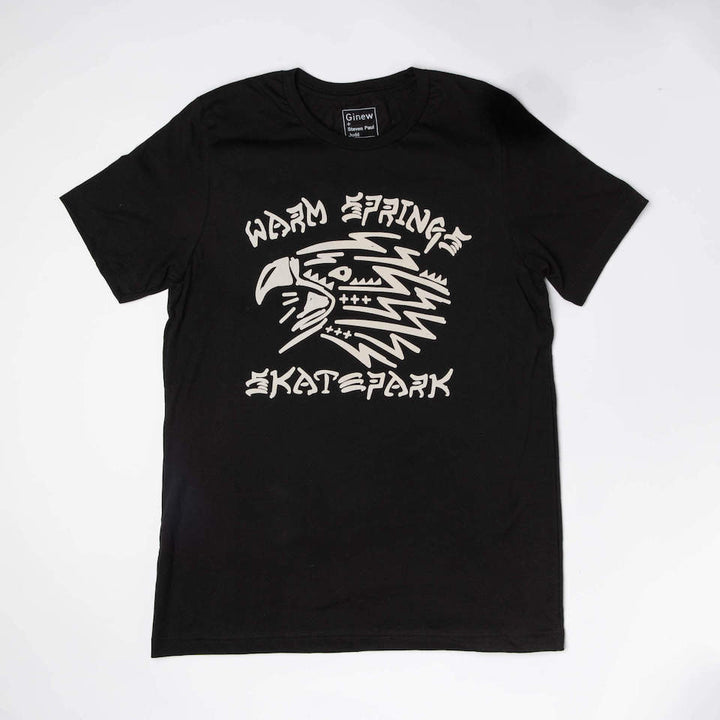Black tee shirt with off-white design of the head of an eagle and the words Warm Spring Skate Park