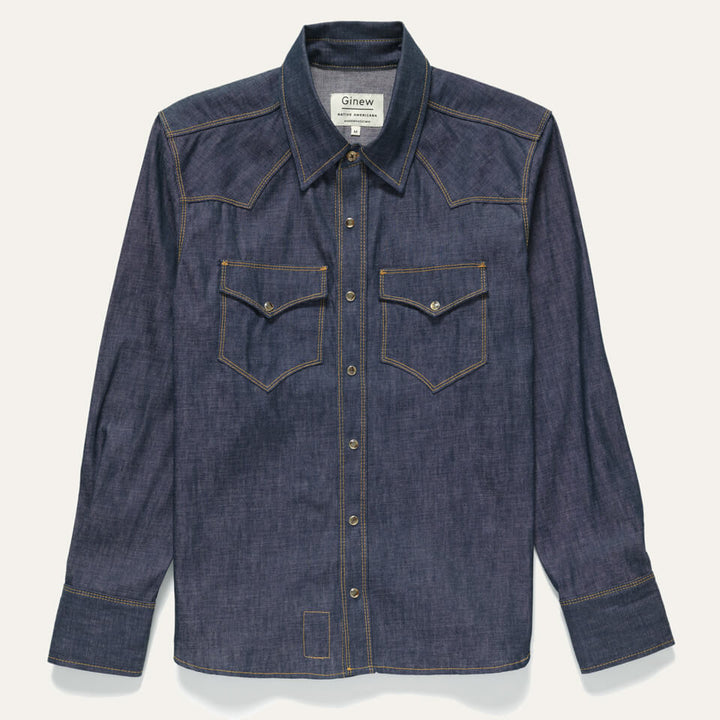 Western Snap Shirt Chambray on white background. Is 100% cotton Chambray and features pearl snaps down the front and on front two pockets.