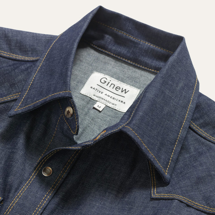 Close up of the tag inside the back of shirt. Tag reads: "Ginew / Native Americana"