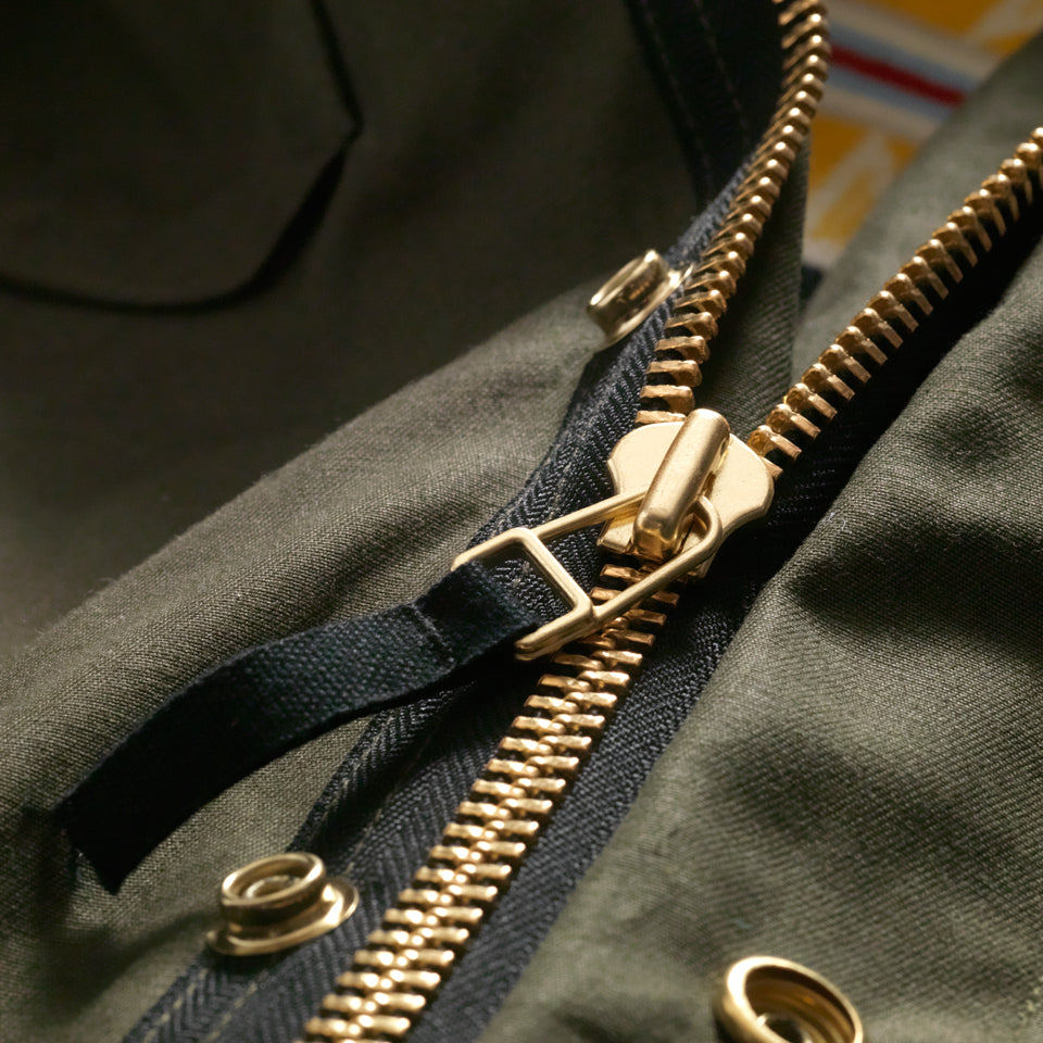 Brass hardware on military style jacket from Native American owned Ginew