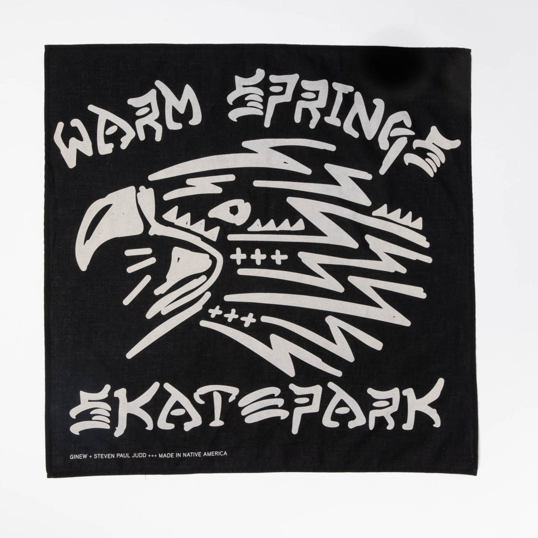 Black bandana with off-white design of the head of an eagle and the words Warm Spring Skate Park