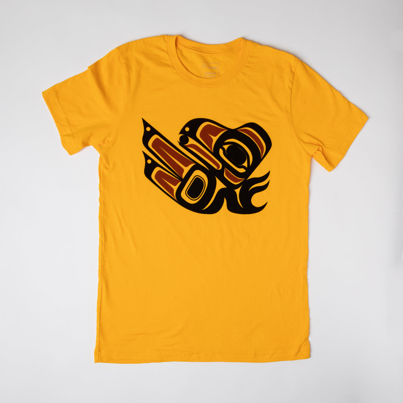 Yellow tee shirt laying flat on a neutral background. The tee shirt has a graphic design of a Raven in black and red ink.