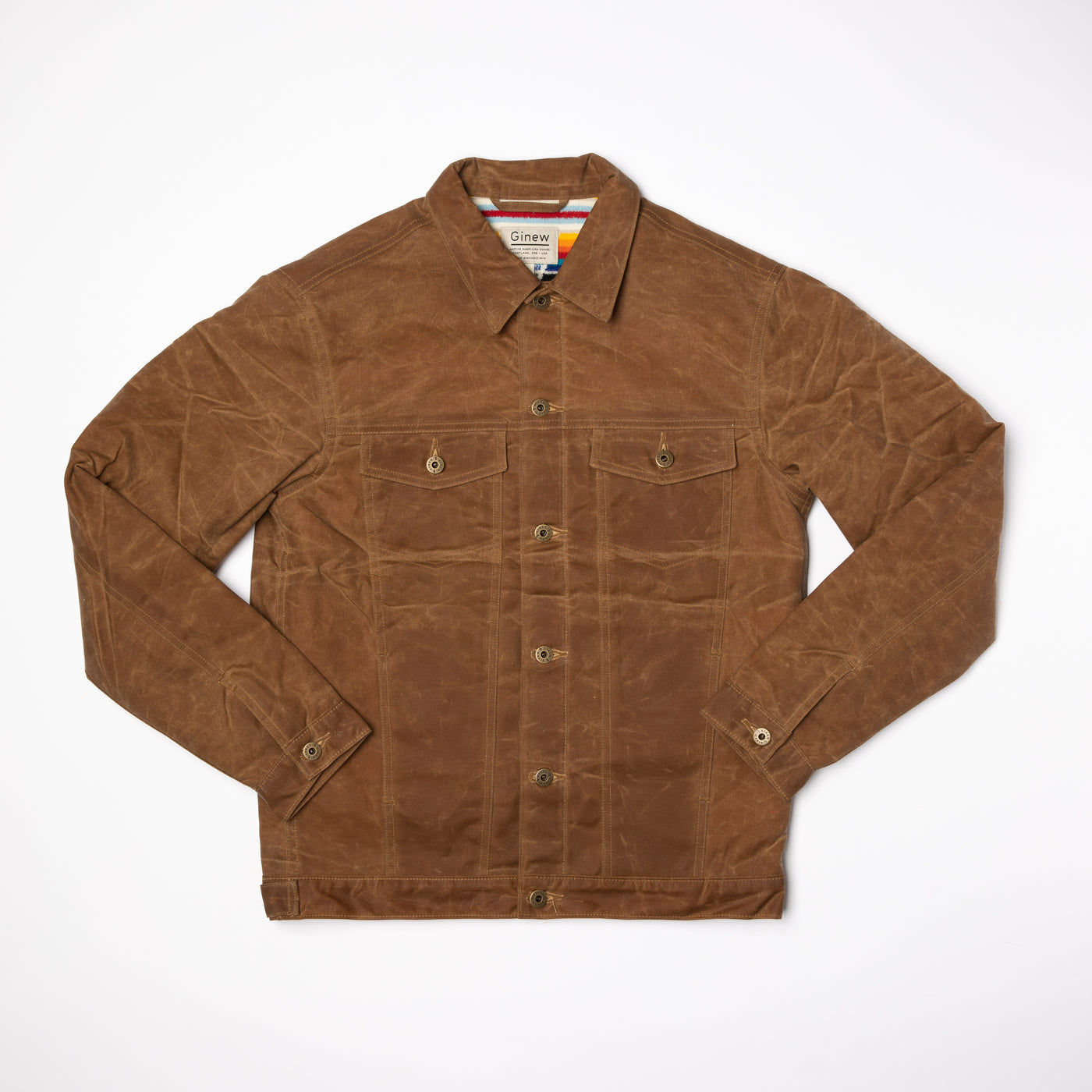 Full view of Wax Rider Coat in Brown front buttoned with Custom Ginew Hardware. Coat on a neutral Background.