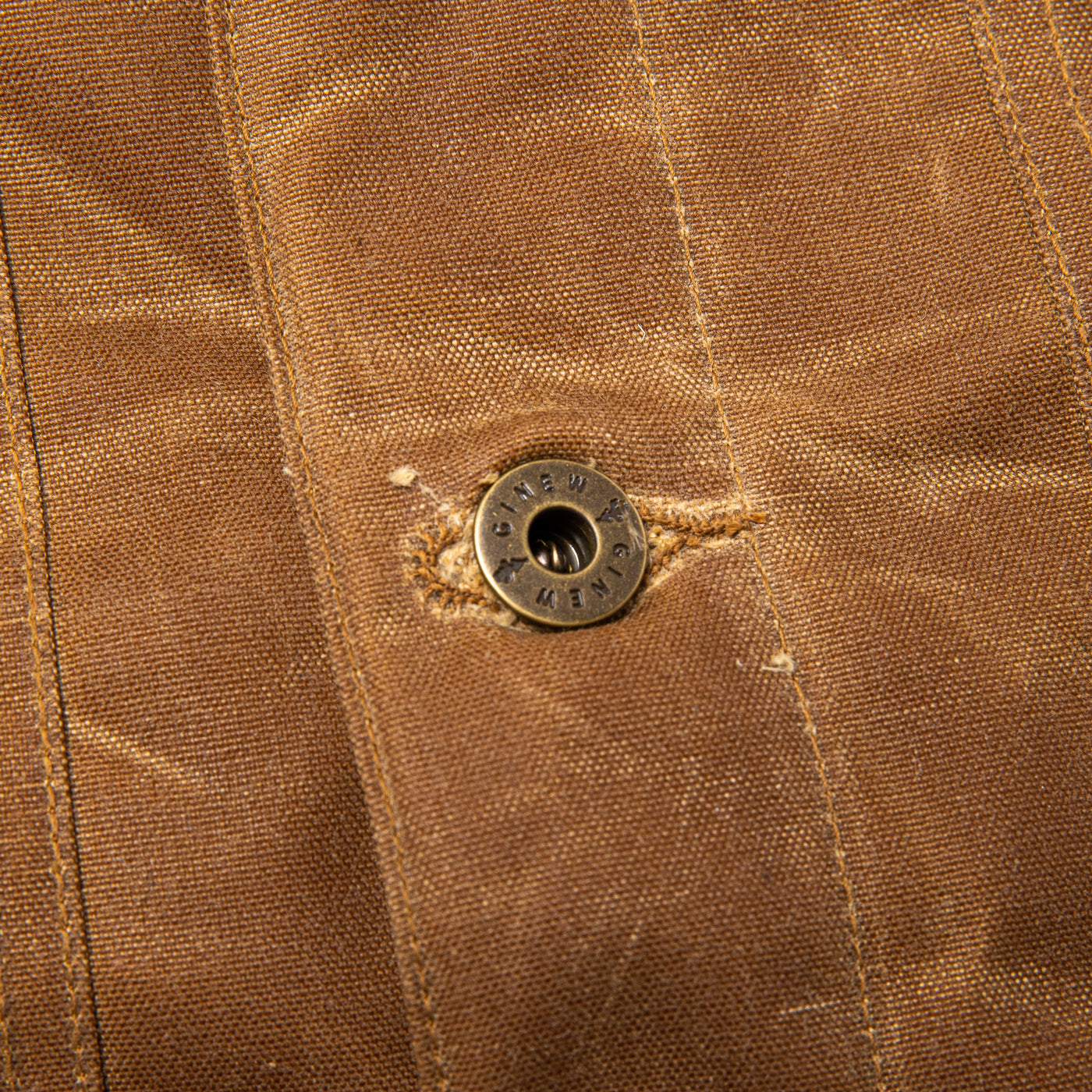 Detail view of Custom Hardware that reads GINEW and features our Genesis Oak Leaf.