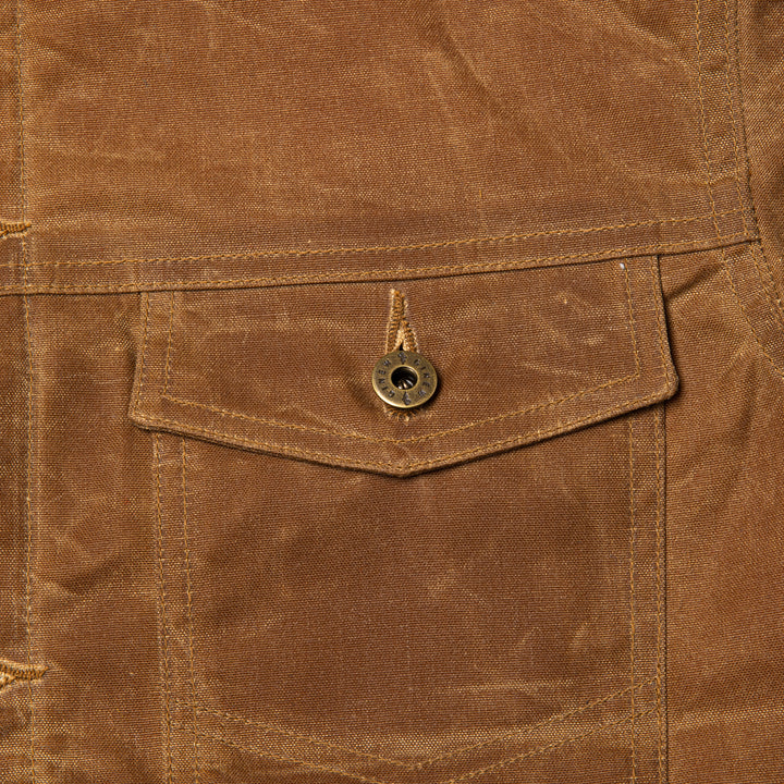 Detail view of front chest pocket on Coat.