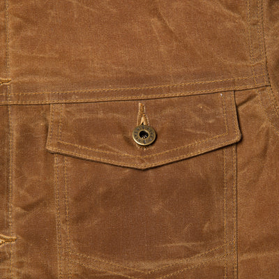 Detail view of front chest pocket on Coat.