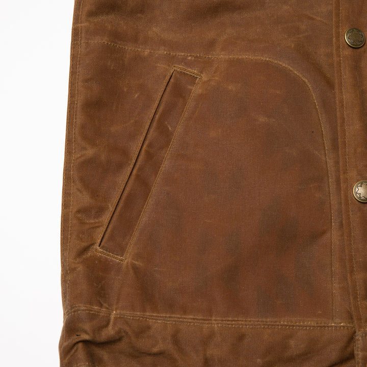 Pocket detail on Brown wax canvas vest water resistant and made in USA by Ginew