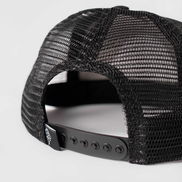A close-up of the black Trucker Hat's adjustable plastic back band. Shown on a white background.